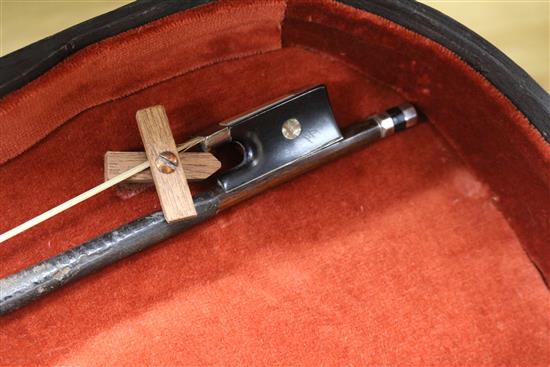 A silver mounted violin bow, an ivory mounted violin bow and a late 19th century German violin, cased